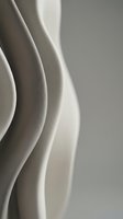 Smooth flowing curves in neutral tones create an elegant abstract composition with soft lighting and minimalist aesthetic for contemporary design projects.