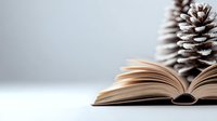 Open book with frosty pine cone against light background, creating cozy winter reading atmosphere. Pages spread naturally, capturing seasonal literary mood.