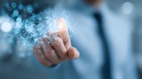 Businessman touching virtual digital interface with finger, creating glowing network connections in futuristic technology concept.