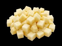 Diced cheese cubes isolated on transparent background, ready for food packaging, recipe graphics, cooking blogs, restaurant menus, and culinary design projects.