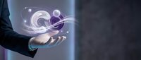 Businessman holding glowing digital sphere with orbital rings and particles in palm, representing innovation, technology solutions and futuristic business concepts.