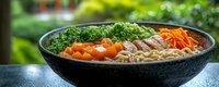 Nutritious Asian noodle bowl with vibrant vegetables including broccoli, carrots, and protein in savory broth, served in black ceramic bowl on stone surface.