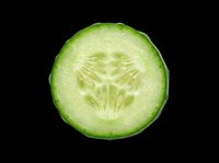 Fresh cucumber slice isolated on transparent background, ready for culinary designs, food packaging, recipe graphics, print-on-demand products and digital food illustrations.