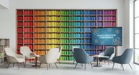 Modern conference room with rainbow colored bookshelf wall and contemporary chairs for business meetings and educational presentations.