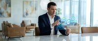 Professional businessman using holographic technology interface in modern office environment for digital innovation and futuristic business solutions.
