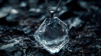 Raw diamond crystal pendant on dark chain necklace against black stone background for luxury jewelry and gemstone accessories design.