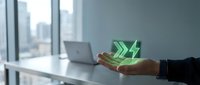 Businessman holding glowing green arrow symbol above laptop at modern office desk with city skyline view, representing growth, success, and digital transformation for corporate business concepts.