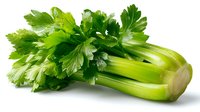 Fresh green celery stalks with leafy tops isolated on white background, ready for healthy cooking or garnishing dishes.