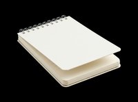 Spiral-bound notebook with blank white pages and metal coil binding, isolated on transparent background. Ready for design use on t-shirts, stickers, print-on-demand products, and digital designs.