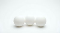 Three white spheres arranged in a row on neutral background, isolated and ready for design projects, presentations, and digital compositions.