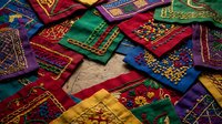 Colorful traditional textile patches with intricate embroidered patterns and geometric designs scattered in vibrant arrangement for crafting projects.