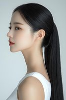 Side profile portrait of young Asian woman with long black straight hair in ponytail, wearing white sleeveless top against light background, showcasing natural makeup look.