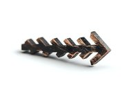 Rustic copper arrow brooch pin isolated on white background, showing vintage metalwork detail and weathered patina texture for jewelry design projects.