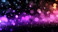 Magical glowing bokeh lights in purple and pink colors against dark background with sparkling particles creating dreamy atmospheric effect.