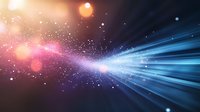 Cosmic light rays burst through space with glowing particles and bokeh effects in blue and pink colors against dark background, creating magical atmosphere.