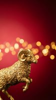 Ornate golden ram figurine with intricate decorative detailing against deep red background with warm bokeh lights, suitable for luxury, wealth, and festive holiday designs.