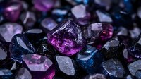 Raw purple and blue fluorite crystals in dark setting with dramatic lighting highlighting natural mineral formations and geometric crystalline structures.