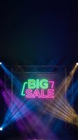 Neon big sale sign with colorful stage lighting and metal truss framework for promotional marketing campaigns and retail advertising backgrounds.