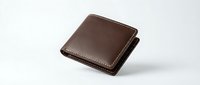 Brown leather wallet with contrast stitching isolated on white background for product photography and commercial use.