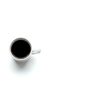 White coffee mug with black coffee on clean white background, minimalist overhead view for cafe branding and beverage marketing materials.