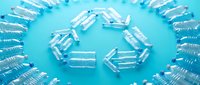 Transparent medical capsules arranged in circular arrows pattern on blue background, symbolizing medication cycle, pharmaceutical rotation, and healthcare treatment process.