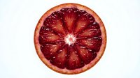 Fresh blood orange slice isolated on white background, showing vibrant red flesh and natural citrus texture. Use for food, beverage, nutrition, and culinary design projects.