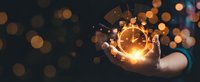 Professional businessman holding glowing clock with gears symbolizing time management and productivity in corporate environment with bokeh lights.