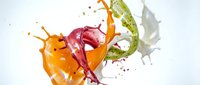 Colorful liquid splash with orange, pink, green and white paint creating dynamic motion against clean background for creative projects.