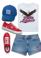 Patriotic apparel collection featuring USA 250th anniversary themed clothing and accessories including blue cap, white graphic tee with eagle design, red canvas sneakers, and denim shorts for holiday celebrations.