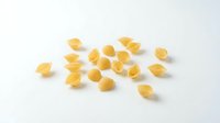 Scattered corn kernels isolated on white background, ready for food, agriculture, and cooking design projects.