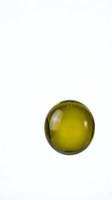 Green glass sphere isolated on white background for modern design projects and contemporary decor concepts.