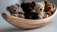 Soft plush teddy bears in different shades of brown arranged in wooden decorative bowl against neutral background, creating cozy home atmosphere.