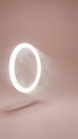 Glowing white neon oval ring light on soft mauve background, modern minimalist design for contemporary interior decor and lighting concepts.