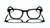 Pair of black eyeglasses with clear lenses isolated on white background, ready for design mockups, product presentations, and fashion-related projects.