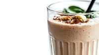 Creamy chocolate milkshake with cocoa powder dusting and fresh mint garnish in tall glass with black straw on white background for cafe menu design.