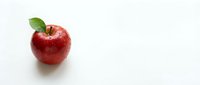 Fresh red apple with green leaf isolated on white background for healthy eating and nutrition concepts.