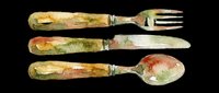 Vintage flatware set with weathered handles featuring aged patina, isolated on transparent background, ready for design use on t-shirts, clipart, stickers, and print-on-demand products.