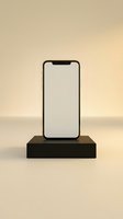 Smartphone with blank screen displayed on black rectangular pedestal against neutral beige background, suitable for app mockups and mobile technology presentations.
