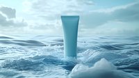 Turquoise cosmetic tube floating in ocean waves against cloudy sky background. Clean skincare product packaging mockup with water splashes and sea foam.