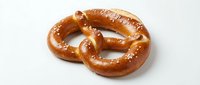 Freshly baked pretzel with coarse salt crystals on white background, ready for bakery, food packaging, restaurant menus, and culinary designs.