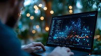 Professional analyzing financial market data on laptop with glowing charts and graphs against blurred bokeh lights background at night.