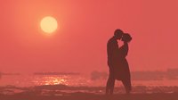 Romantic couple silhouette embracing on beach at sunset with golden sun and coral sky reflecting on ocean waves creating intimate moment for love concepts.