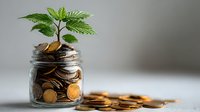 Young green plant growing from glass jar filled with golden coins symbolizing financial growth and investment success for business concepts.