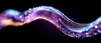 Glowing wave of purple and blue light particles flowing on black background creates magical energy effect with sparkling bokeh elements and motion blur.