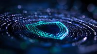 Digital circular pattern with glowing turquoise and blue particles forming dynamic spiral shape against dark background with bokeh light effects and depth of field.
