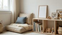 Cozy reading corner with beige cushions, blue pillow, wooden bookshelf and blank frame in bright modern living room interior for relaxation.