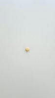 Single yellow sphere isolated on neutral gray background, minimalist composition suitable for design projects, web graphics, and creative layouts.