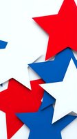 Red white and blue paper stars arranged in patriotic composition with layered shadows for holiday celebrations and national events.