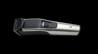 Cordless hair clipper with stainless steel and black plastic body, featuring adjustable cutting head and control buttons, isolated on transparent background ready for design use on t-shirts, clipart, stickers, and print-on-demand products.