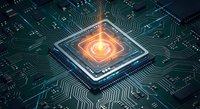 Glowing microprocessor chip with orange light on dark circuit board showcasing advanced semiconductor technology and electronic components for tech designs.